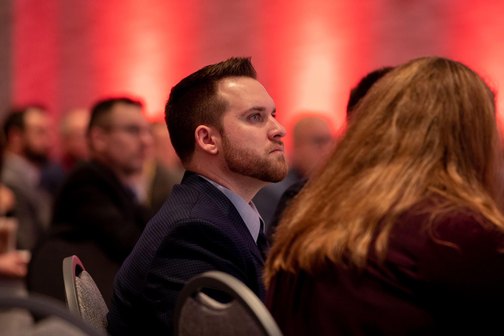 Central agent Kaine Diver listens as a keynote delivers a message at the annual Multi-Line Marketing Convention.