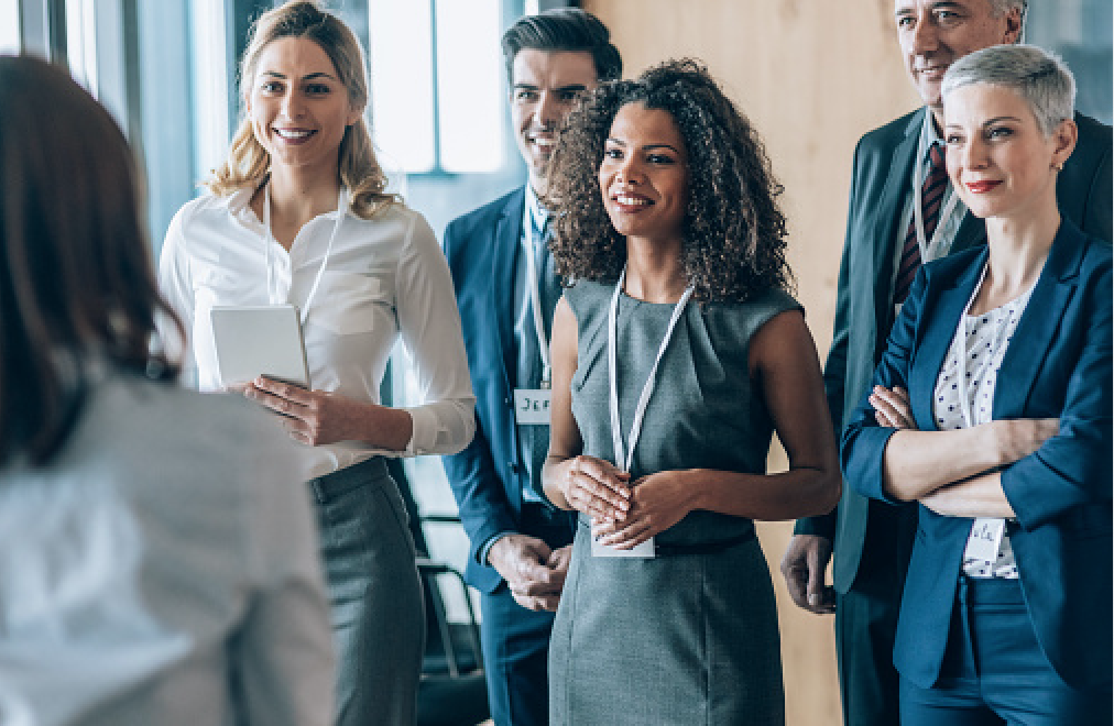 A group of professionals listening to a speaker